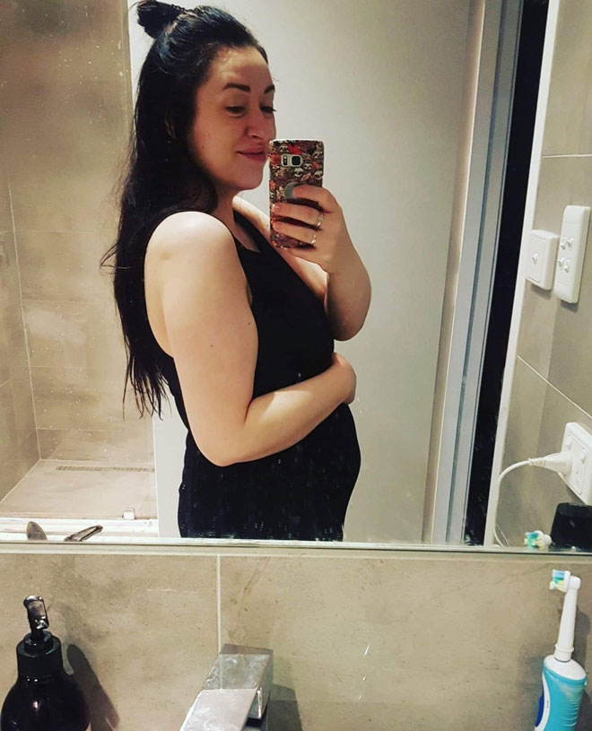 Sally snaps a pregnant selfie in the bathroom 