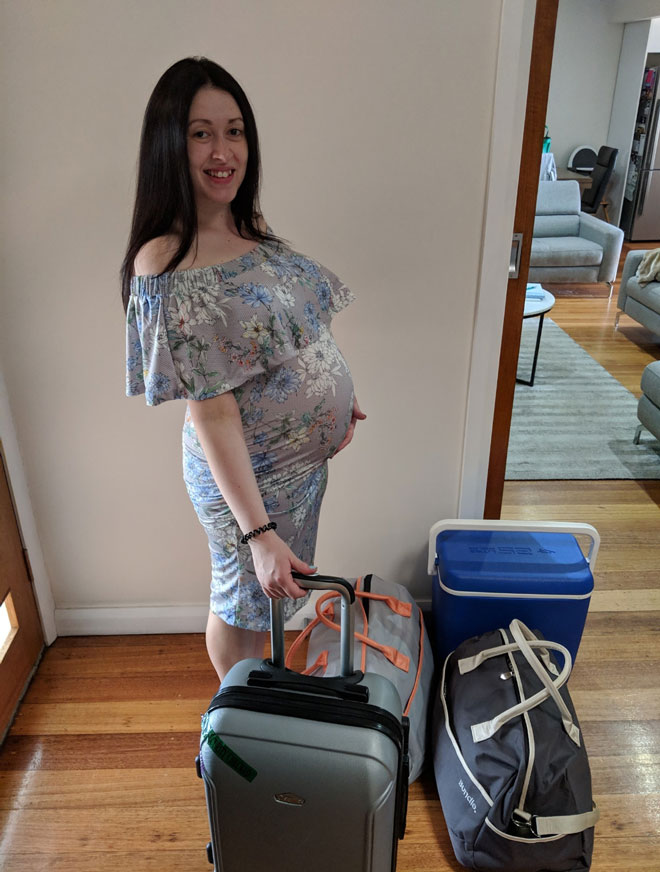Sally pregnant with her bags packed for hospital