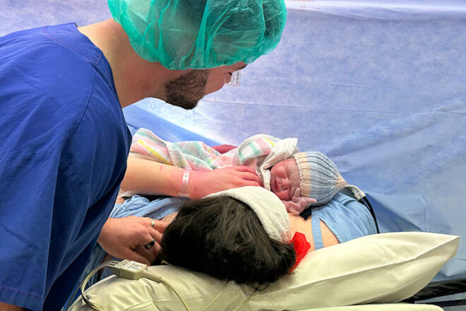 Tenae and Cameron holding newborn