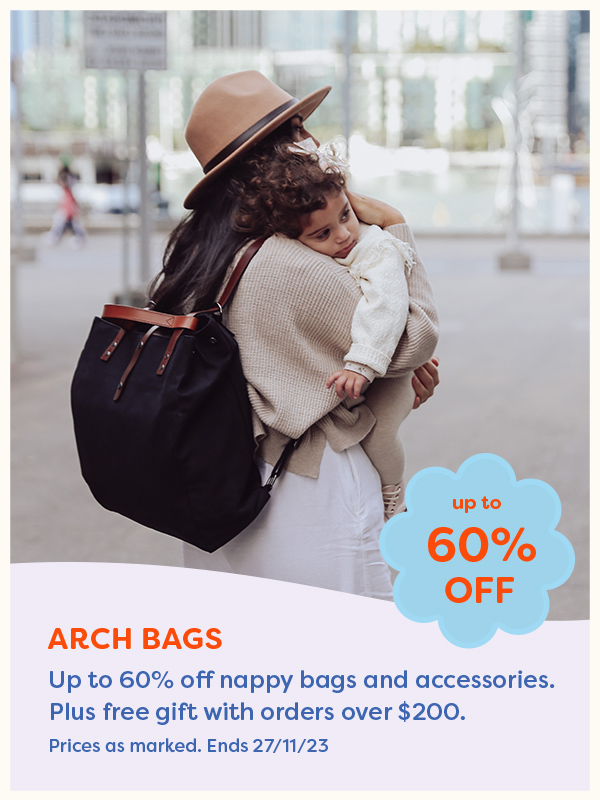 A mother holding a child wearing the ARCH Bags nappy bag