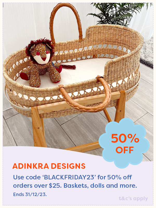 Baby moses basket on a stand with toy lion sitting inside from Adinkra Designs