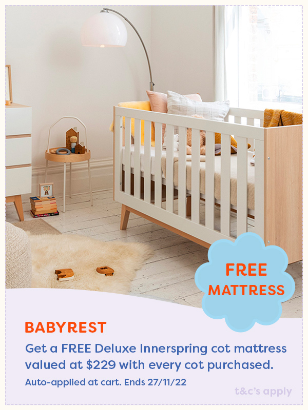 Babyrest cot in a baby nursery with sheepskin rug on the floor