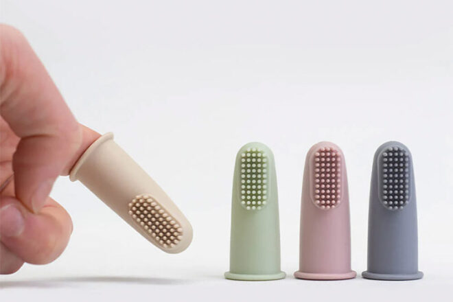 Cherub Baby Silicone finger toothbrushes in assorted colours showing function and relative size.