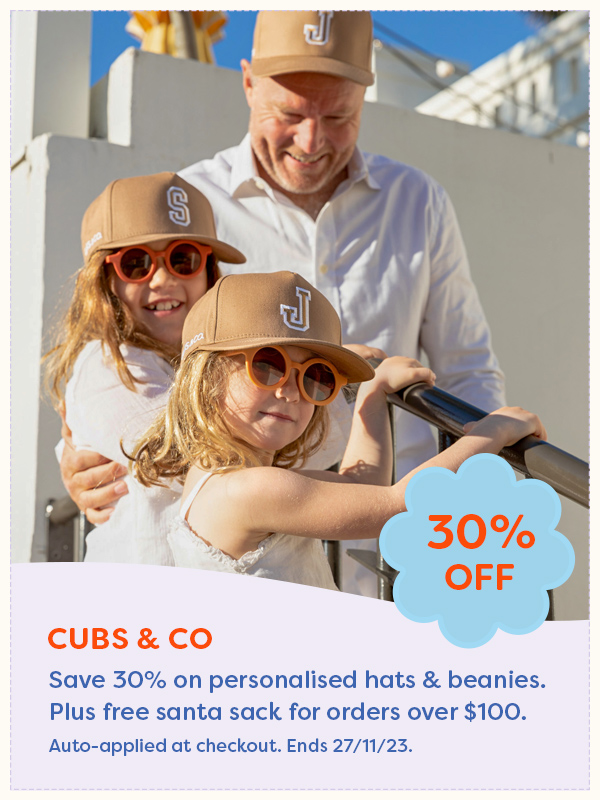Two children and a father walking down stairs in matching caps from Cubs and Co