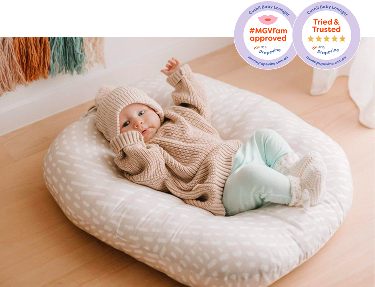 Baby laying in the Cushii baby lounger