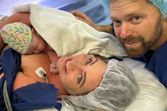 Danielle smiles with her baby after giving birth via C-section