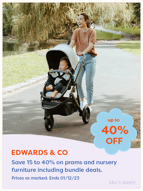 A mother walking her baby in an Edwards & Co pram