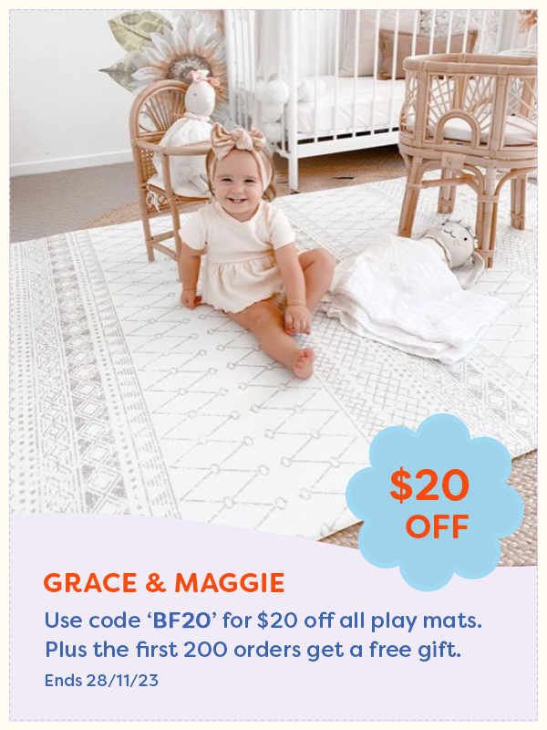 A baby sitting on a Grace & Maggie playmat
