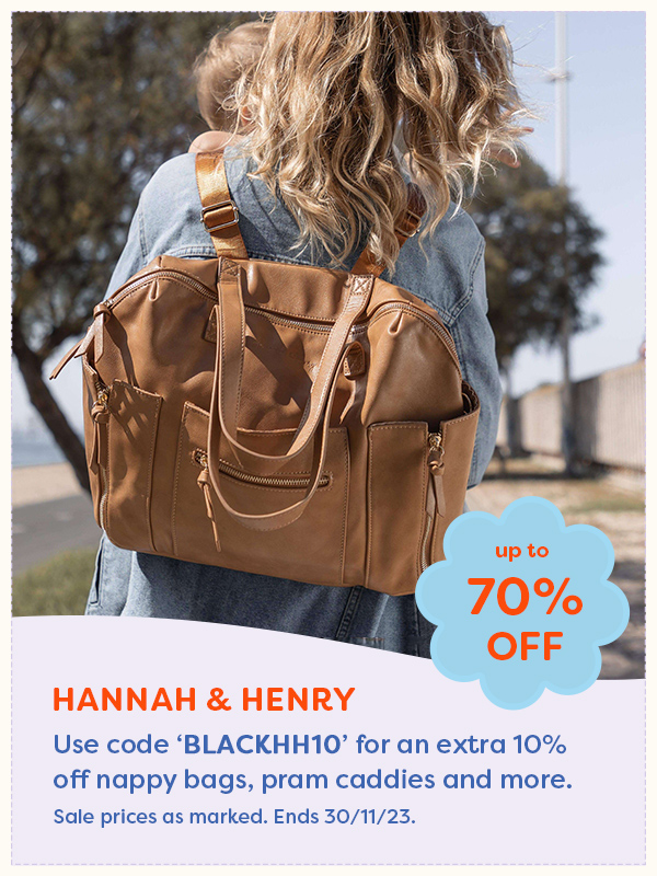 A woman wearing a nappy backpack from Hannah & Henry
