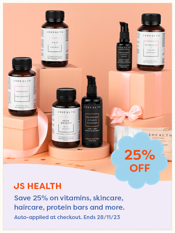 JSHealth skin care and vitamins displayed at different levels with a coral back drop