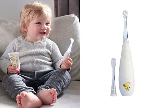 Baby holding the Jack N Jill Tickle Tooth Sonic Toothbrush