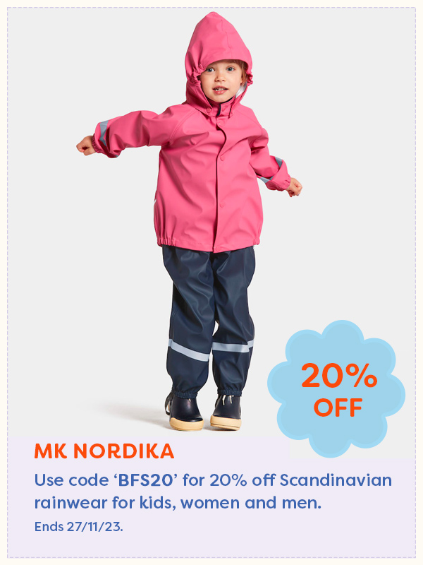 Young girl wearing pink raincoat and navy waterproof pants from MK Nordika