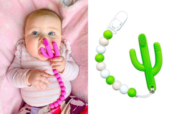 A baby holding the Pickle & Olive Infant Training Toothbrush