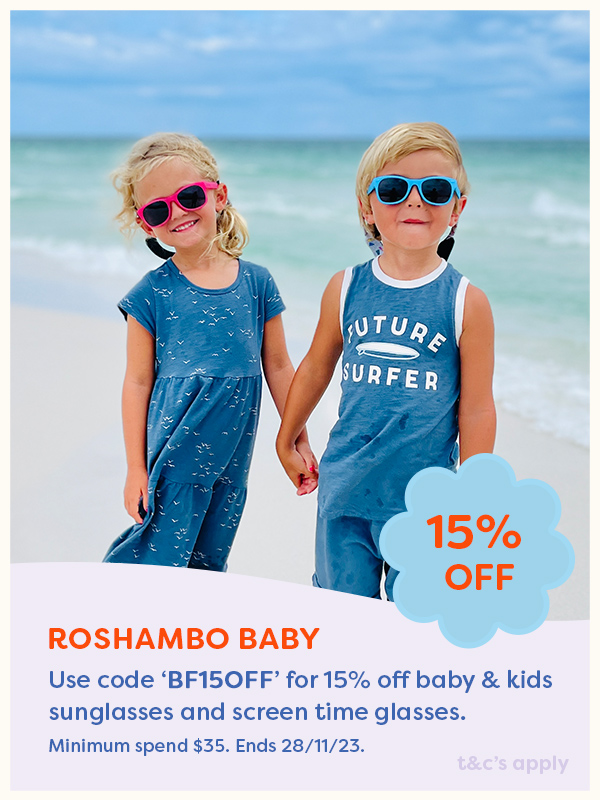 Two children at the beach wearing Roshambo toddler sunglasses
