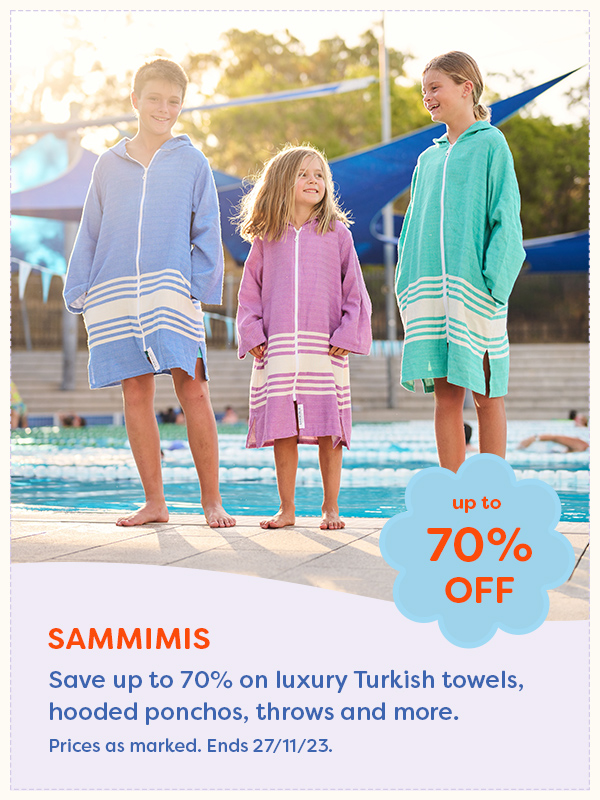 Three children wearing SAMMIMIS hooded beach towels