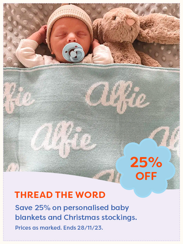 Young baby asleep under a personalised baby blanket from Thread the Word