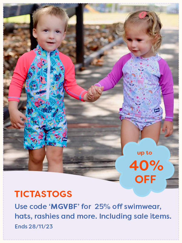 Two children holding hands wearing TicTasTogs kids swimwear
