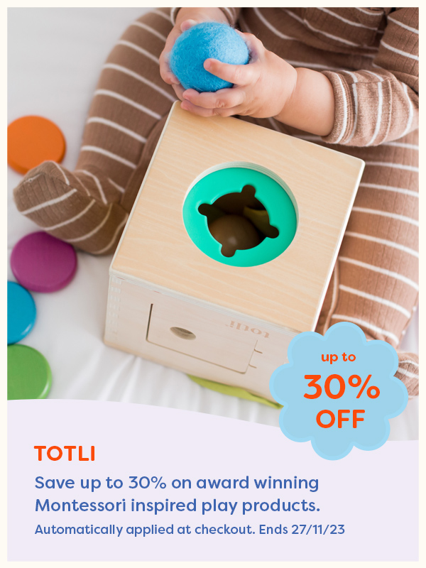 A baby playing with a Montessori toy from Totli