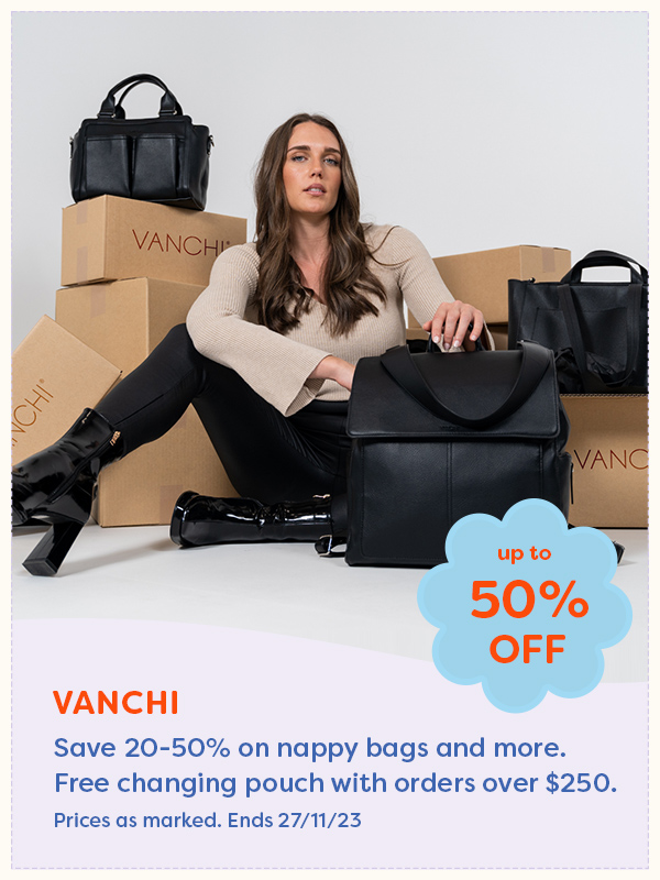 A woman sitting surrounded by boxes and nappy bags from Vanchi
