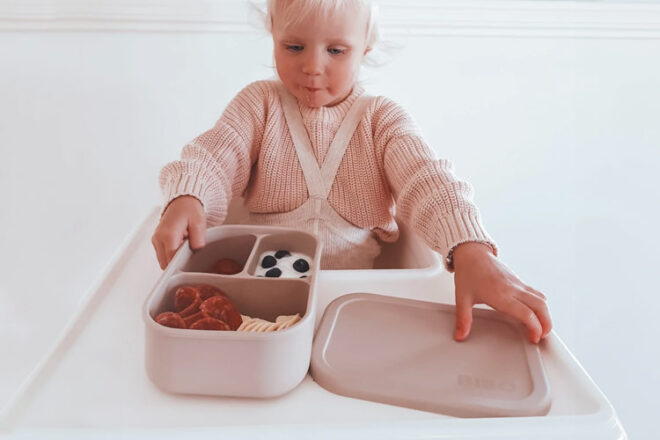 young girl eating from a Bibo Bubs bento box