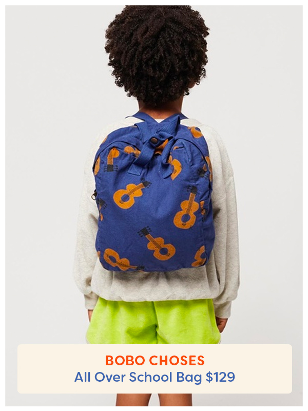 Back of boy wearing a Bobo Choses backpack