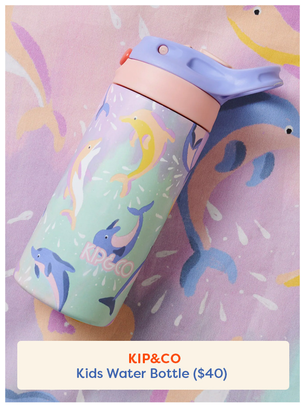 The Kip&Co drink bottle laying on its side with a dolphin design