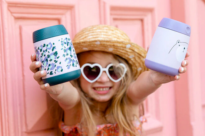 Girl with heart sunglasses holding two b.box mini food jars 