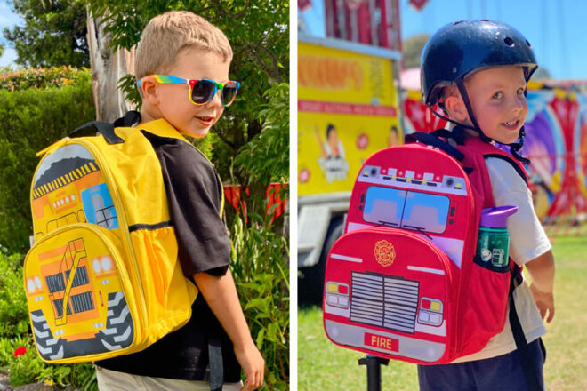 Two young boys wearing the jude&moo backpacks in dump truck and fire truck