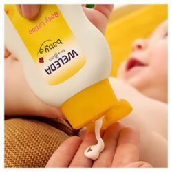 The Weleda Baby Lotion cream being used