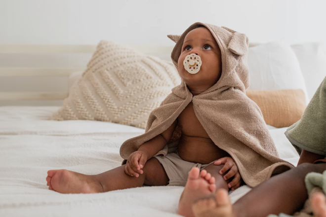 Young child wearing BIBS Kanagroo organic hooded towel after a bath