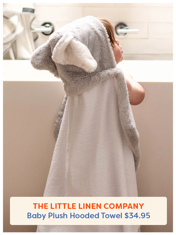 A baby wearing The Little Linen Baby Plush Hooded Towel in Soft Grey