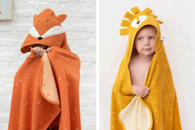 Two children wearing Trixie Hooded towels in Mr. Fox and Mr. Lion