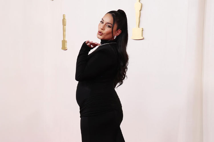 Actress Vanessa Hudgens posing pregnant on the Oscars Red Carpet