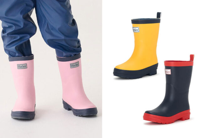 A young child wearing Hatley Rain Boots with the boots in two other colourways also shown