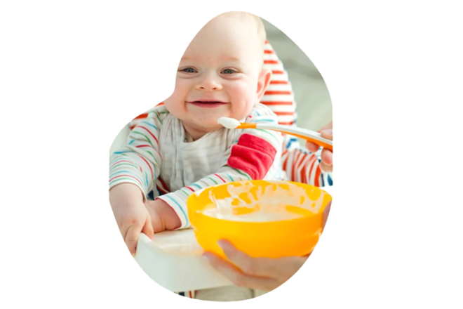 Baby eating yoghurt starting solids
