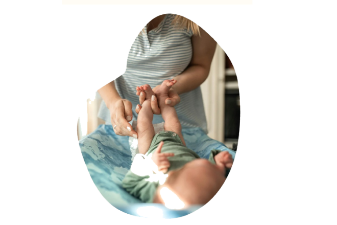 mother changing baby on change table